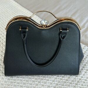 Beautiful vintage black faux leather handbag with gold and crystal accents.